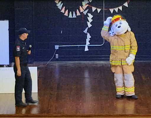 Sparky and Fire Personnel Speaking about fire safety