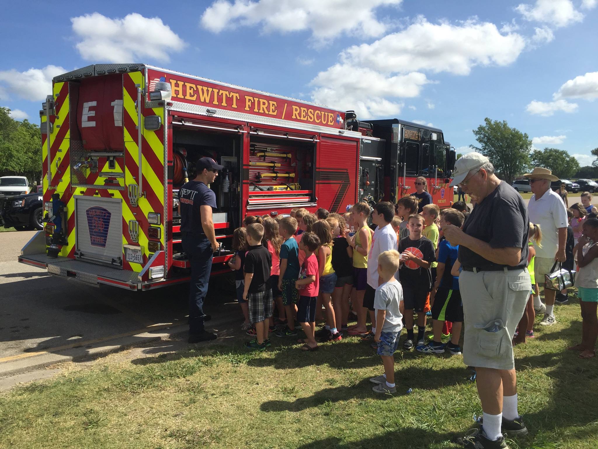 Image of Engine 1 with a children's group.